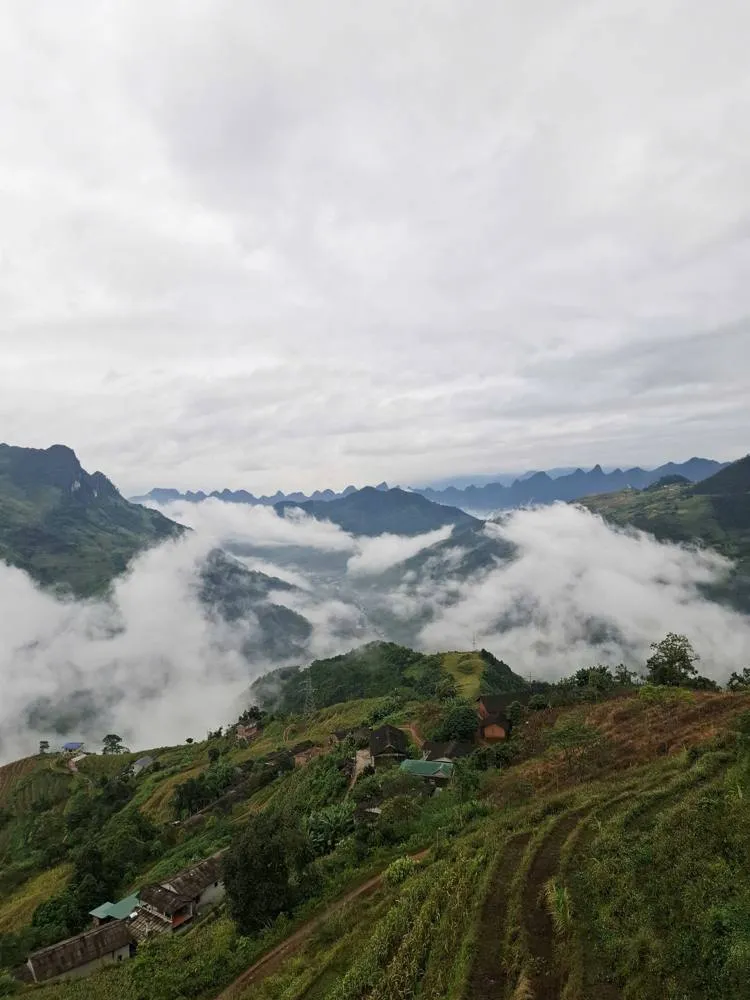 Clouds rolling through a mountain valley at dawn